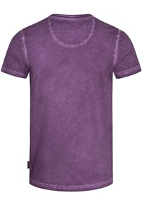 Short-sleeve purple t-shirt with a smooth, slightly textured finish. Round neckline with subtle stitching detail. Label on the side.
