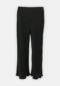 Pantalons larges plissés noirs au design fluide, offrant une texture douce et une taille élastique pour le confort.