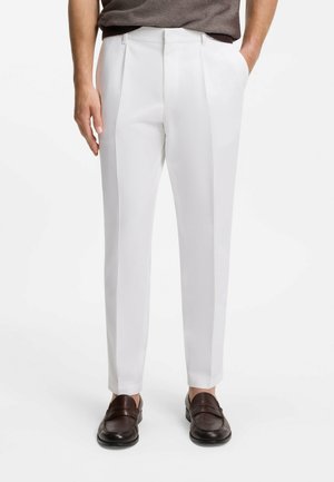 - Spodnie materiałowe