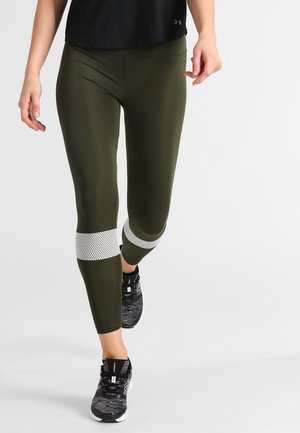 Olive green leggings with a fitted design and mesh white accents at the calf. Made from a stretchy, smooth fabric suitable for active wear.