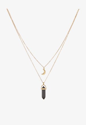 Goldbeschichtete Halskette mit einem Halbmond-Anhänger und einem schwarzen Kristallanhänger in goldfarbener Fassung.