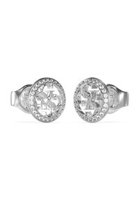 Orecchini in argento con un design circolare, adornati con strass trasparenti attorno a un logo ritagliato al centro. Finitura in metallo liscia.