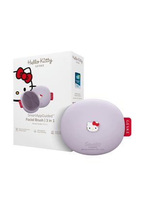 Lavendelfarbene ovale Hello Kitty Gesichtsbürste mit rotem Etikett neben passender Box mit Hello Kitty-Gesicht und Produktdetails.