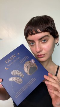 GLOV The Luxe Duo packaging features a navy blue box with golden text, showcasing a leopard print satin sleep cap and silicone eye patches.