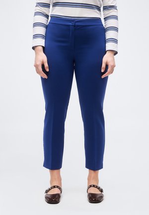 - Spodnie materiałowe