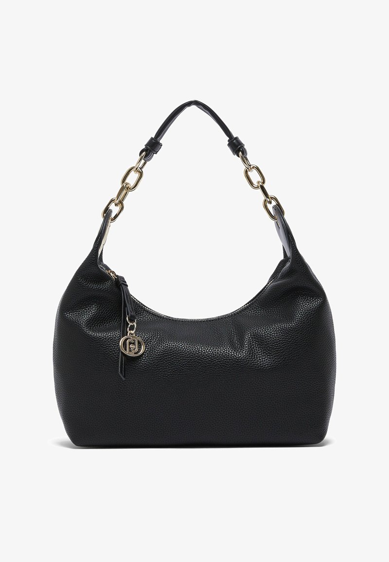 Sac à main en cuir noir texturé avec une poignée courte comprenant des maillons de chaîne dorés et un pendentif rond avec le logo de la marque en or près du curseur de la fermeture éclair.