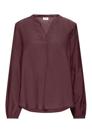 Burgundijska bluza dugih rukava s V-izrezom, teksturiranim materijalom i elastičnim manžetama te lagano zakrivljenim rubom.