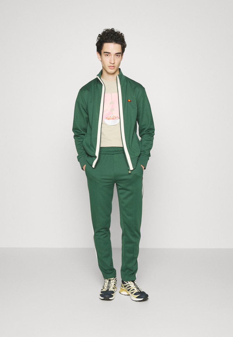 Ellesse Men’s Rimini Sports Jacket – Dark Green, Lightweight With Embroidered Logo & Elastic Cuffs