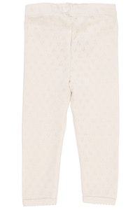 Kremfargede leggings laget av mykt, teksturert materiale med diamantmønster. Har en elastisk midjebånd og bølgete ankelkanter.