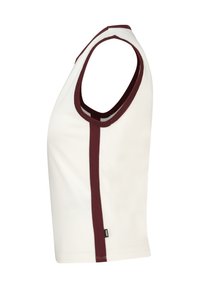 Sleeveless top made of cotton, featuring a cream color with a maroon accent along the neckline and side, smooth texture, and simple design.