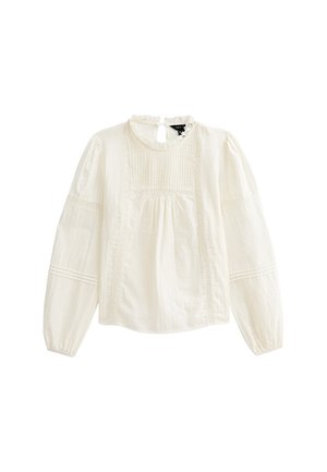 Weiße Baumwollbluse mit langen Puffärmeln, gerüschtem Ausschnitt, vorderen Falten und bestickten Details entlang des Oberteils und der Ärmel.