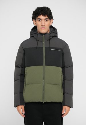 Padded jacket featuring a color-block design in dark gray, black, and olive green. Includes a hood, front zipper, and logo detail.