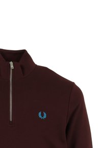 Burgundy sweatshirt with a quarter zip, featuring a blue embroidered logo on the left chest. Soft fabric and high collar design.