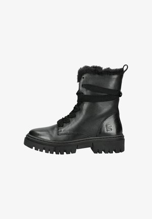 Black leather winter boot with thick rubber sole, fur lining, and wrapped black laces, viewed from the side on a white background.