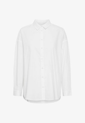 Valge nööbiga särk klassikalise kraega, pikkade varrukatega ja kergelt kaarduva hemiga. Valmistatud siledast, opakest kangast.