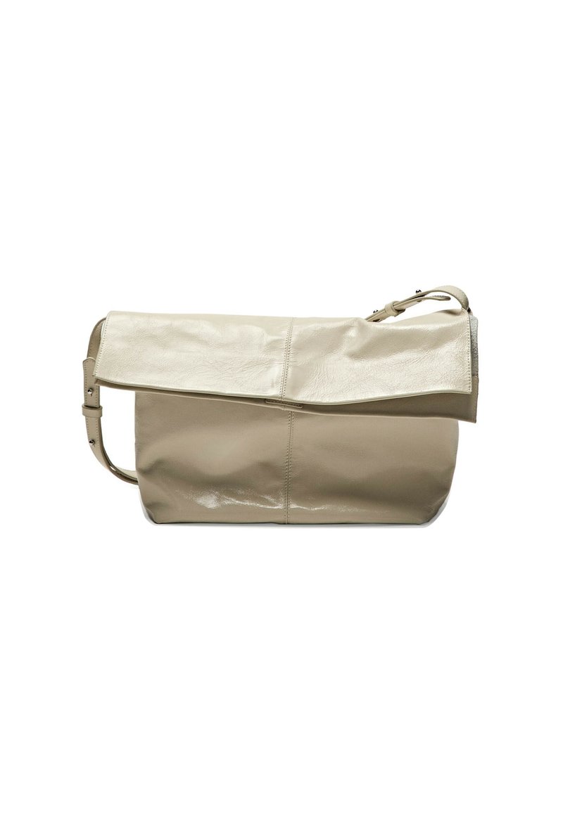 Beige leather bag with a glossy finish, features a fold-over flap, adjustable strap, and minimal stitching details. Sleek and modern design.