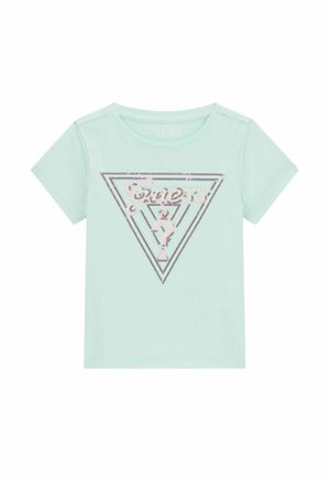 Maglietta azzurra chiaro a maniche corte per toddler con un triangolo del logo Guess decorato con paillettes sul davanti.