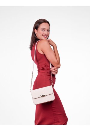 Beige crossbody bag with a flap closure, gold hardware accent, and a chain strap. Smooth texture, rectangular shape, and minimalistic design.