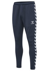 Navy athletic pants made of smooth, stretchy fabric featuring white chevron stripes along the sides and a small logo on the front.