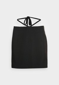 Mini-jupe noire avec un détail de nouage autour du cou à la taille, en tissu lisse et avec une silhouette simple et ajustée.