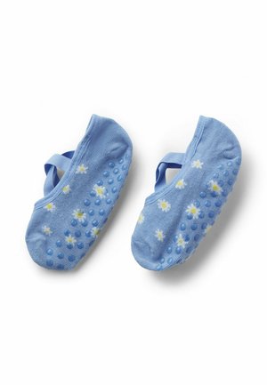 Calzini per bambini azzurri con motivi di margherite bianche e gialle e grip antiscivolo blu sulle suole, con cinturini elastici.