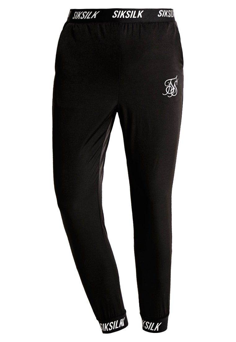 Schwarze Jogginghosen aus weichem Stoff. Mit einem elastischen Bund, der die SIKSILK-Marke trägt, und einem kleinen weißen Logo auf dem Oberschenkel. Eng anliegender Schnitt.