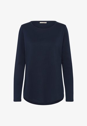 Mornarska majica s dolgimi rokavi in okroglim izrezom, izdelana iz mehkega materiala, z ukrivljenim robom in minimalnimi šivnimi detajli.