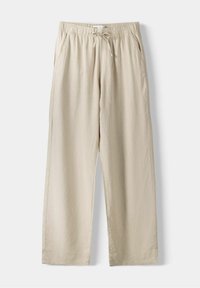 Beiget pellavahousut, joissa on joustava vyötärönauha ja kiristysnyöri. Suorat lahkeet, sivutaskut ja hienovarainen tekstuuri.