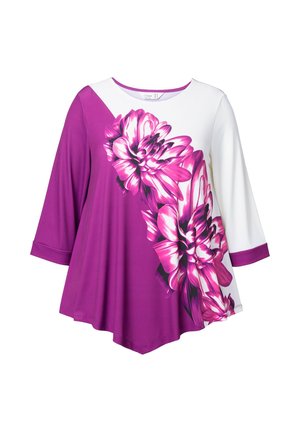 Lila und weiße Tunika mit einem großen pinken Blumenmuster. Weite Ärmel und ein abgerundeter Halsausschnitt, aus einem weichen, glatten Stoff gefertigt.