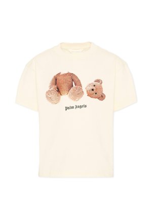 Crème-wit T-shirt met korte mouwen met een afbeelding van een teddybeer, gescheiden in hoofd en lichaam, en de tekst "Palm Angels" eronder.