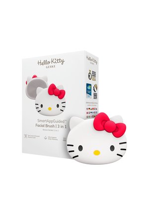 Brosse pour le visage en forme de Hello Kitty avec un nœud rouge, faisant partie d’un coffret de soin de la peau 3-en-1 guidé par une application intelligente.