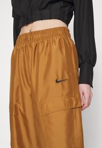 Nike Sportswear Träningsbyxor - brown