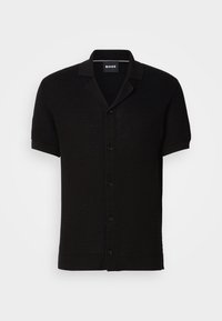 Chemise noire à manches courtes en tricot texturé avec ouverture boutonnée sur le devant et col cranté, marquée du label "BOSS" à l'intérieur du col.