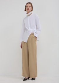 Calliope LUNGO BOTTONE - Pantaloni - beige