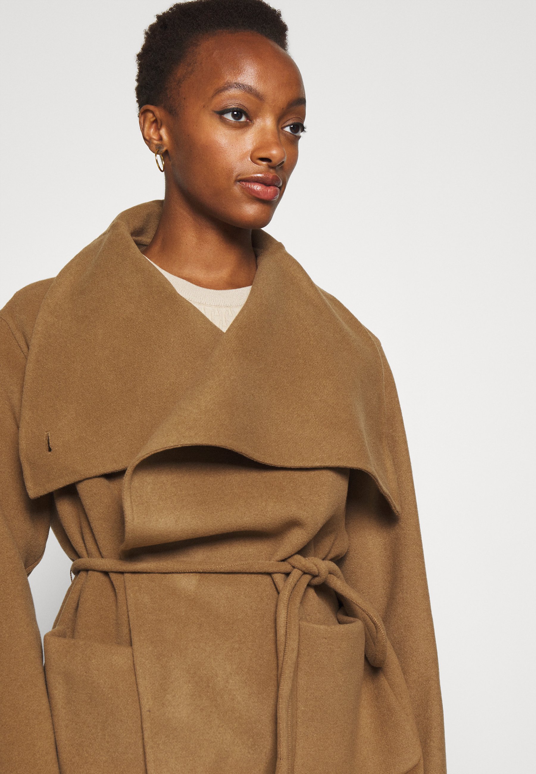 tan belted coat