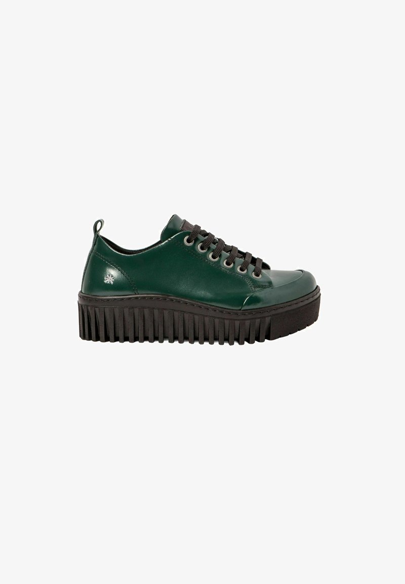 Green leather sneaker with black thick ridged sole, black laces, and a small silver star logo near the heel.