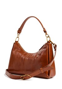 Sac à main en cuir marron avec une forme incurvée, une poignée courte et une bandoulière détachable. Présente des ferrures dorées et des détails de couture visibles.