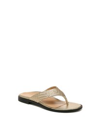 Gold woven straps cross over a nude footbed, leading to a black flat sole. The shoes are thong-style with a sleek design.