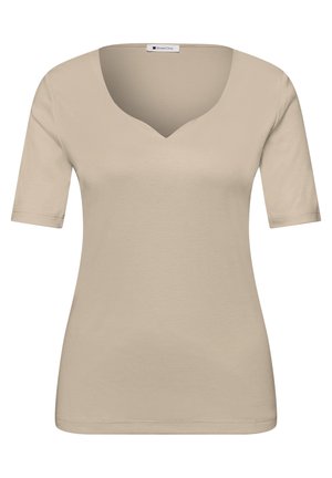 Haut beige pour femmes à manches courtes avec un col en V subtil et une silhouette ajustée, présenté sur un fond blanc.