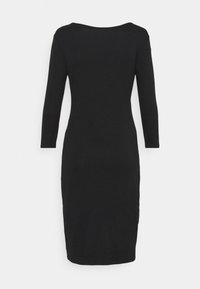 Svart långärmad klänning med en figurnära silhuett, enkel design och rund halsringning. Tillverkad av ett mjukt tyg, når knäet.