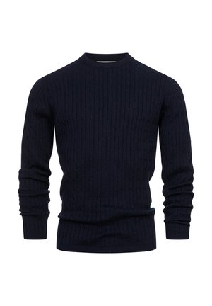 Mornarice plavi pletena majica s rebrastom teksturom, okruglim izrezom i dugim rukavima. Ima uzorak kabelnog pletenja kroz cijelu tkaninu.