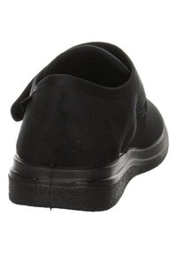 Schwarzer Schlupfschuh mit einem weichen Stoffoberteil, runder Zehenform und strukturierter Gummisohle. Verfügt über einen elastischen Einstieg für einfaches Anziehen.