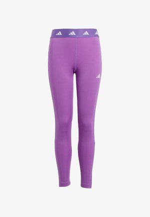 Leggings de sport violets avec une texture lisse, dotés d'une large ceinture ornée d'accents triangulaires blancs. Conçus pour le confort et la liberté de mouvement.