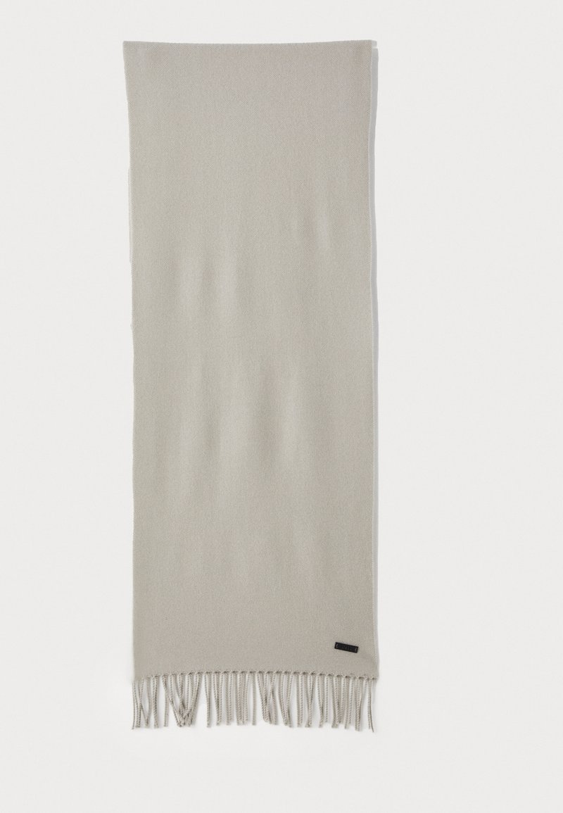 Light beige rectangular scarf with twisted fringe on both ends and a small black brand label near one end.