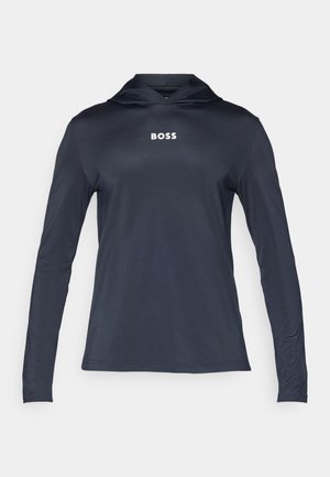 Jūras spēku ilgas piedurknes kapuce, kas izgatavota no viegla, gluda materiāla. Tam ir aukla kapuce un uz krūtīm baltā krāsā ir drukāts vārds "BOSS".