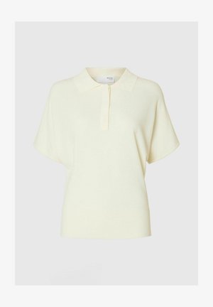 Korte mouwen polo shirt in zacht, lichtgeel materiaal. Kenmerkt zich door een klassieke kraag en een knoopsluiting met een relaxte pasvorm.