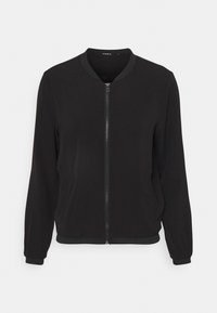 Zwarte bomberjack gemaakt van gladde stof, met een rits aan de voorkant, geribbelde manchetten en een ronde halslijn. Geen zichtbare patronen of accenten.