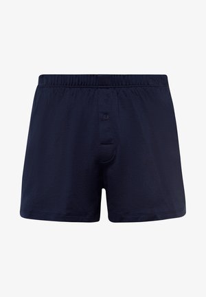 Bóxer de algodón azul marino con cinturilla elástica y cierre de botón en la parte delantera, que cuenta con un solo bolsillo y una textura suave.