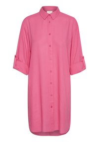 Różowa lniana koszula z kołnierzykiem, z przodu na guziki i z podwiniętymi rękawami. Gładka tekstura i luźny krój z prostym dołem.