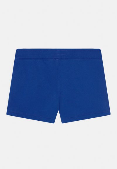 Bermudas de algodão azuis com uma textura suave, apresentando uma cintura elástica larga e uma bainha curta, desenhadas para conforto e facilidade de movimento.